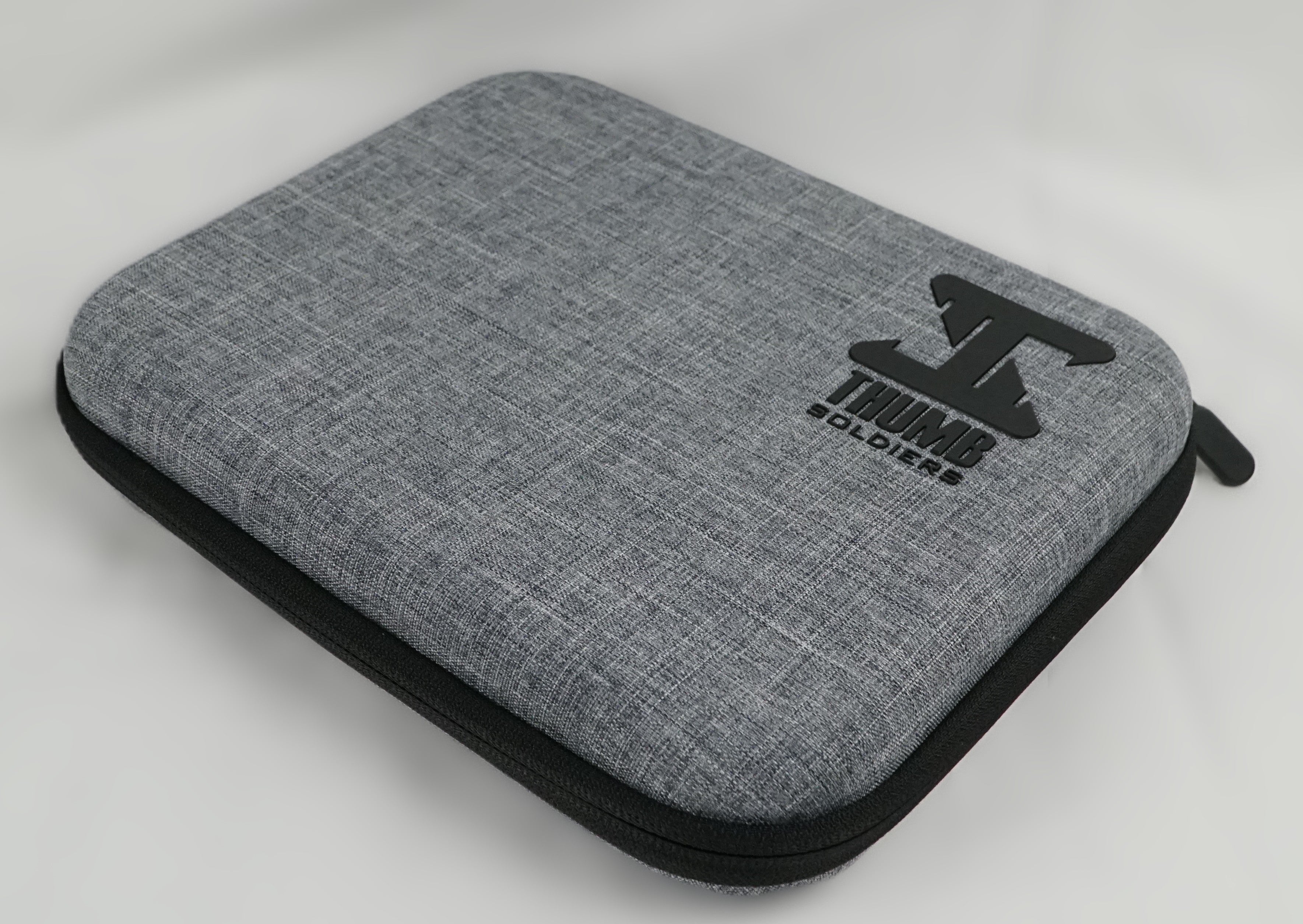 Gray carrying case with black logo on a white background